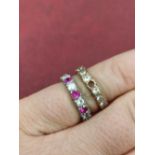 An 18ct hallmarked white gold and an unhallmarked 9ct gold stone set full eternity ring. Gross