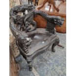 Two similar Oriental carved throne armchairs.