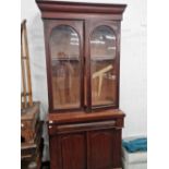 A mahogany book case.