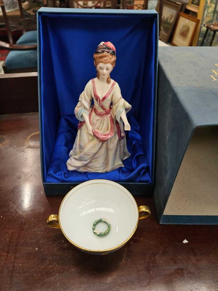 A Royal Doulton figure and Minton cup