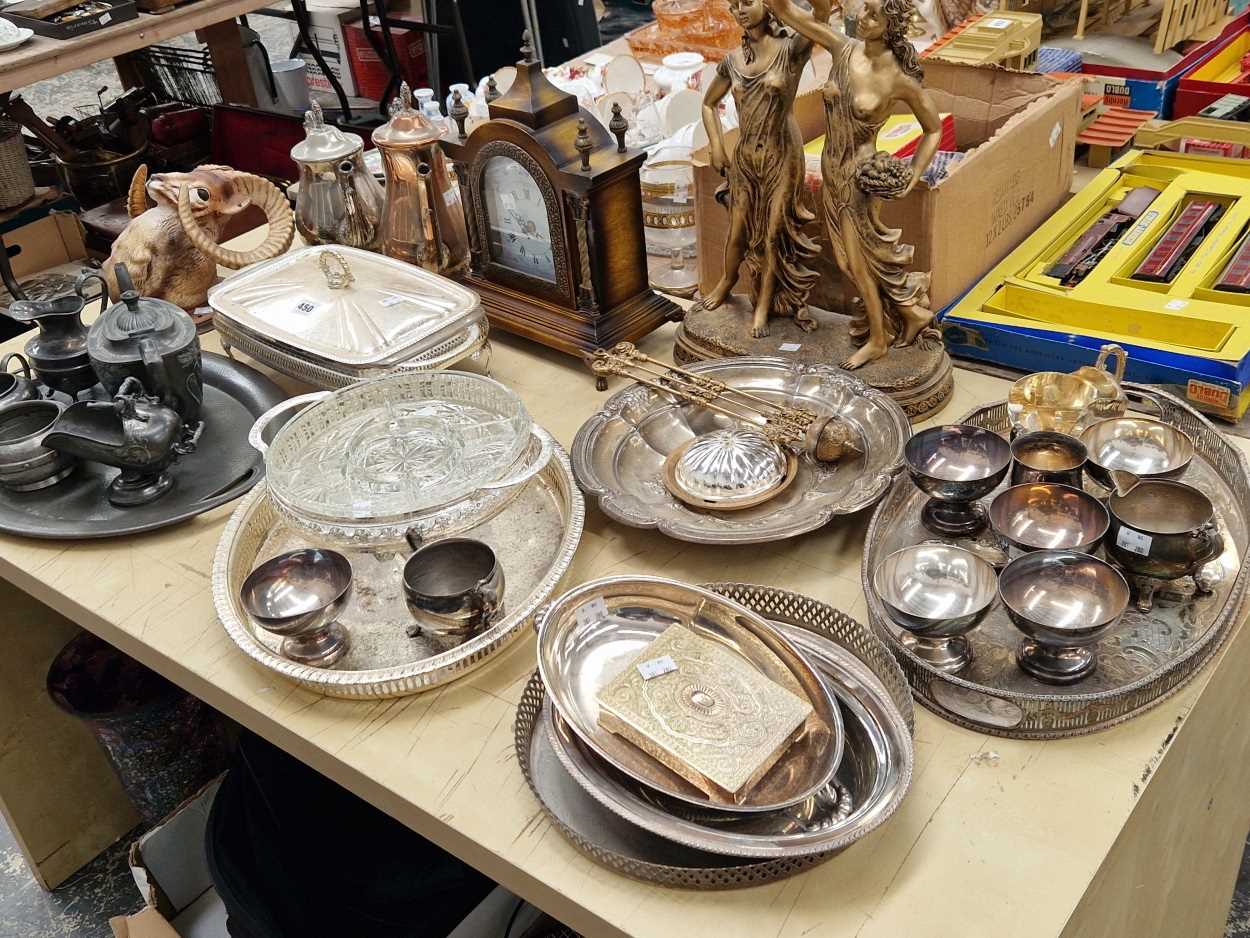 Two mantel clocks to include one held up by two classical ladies, electroplate and a pewter