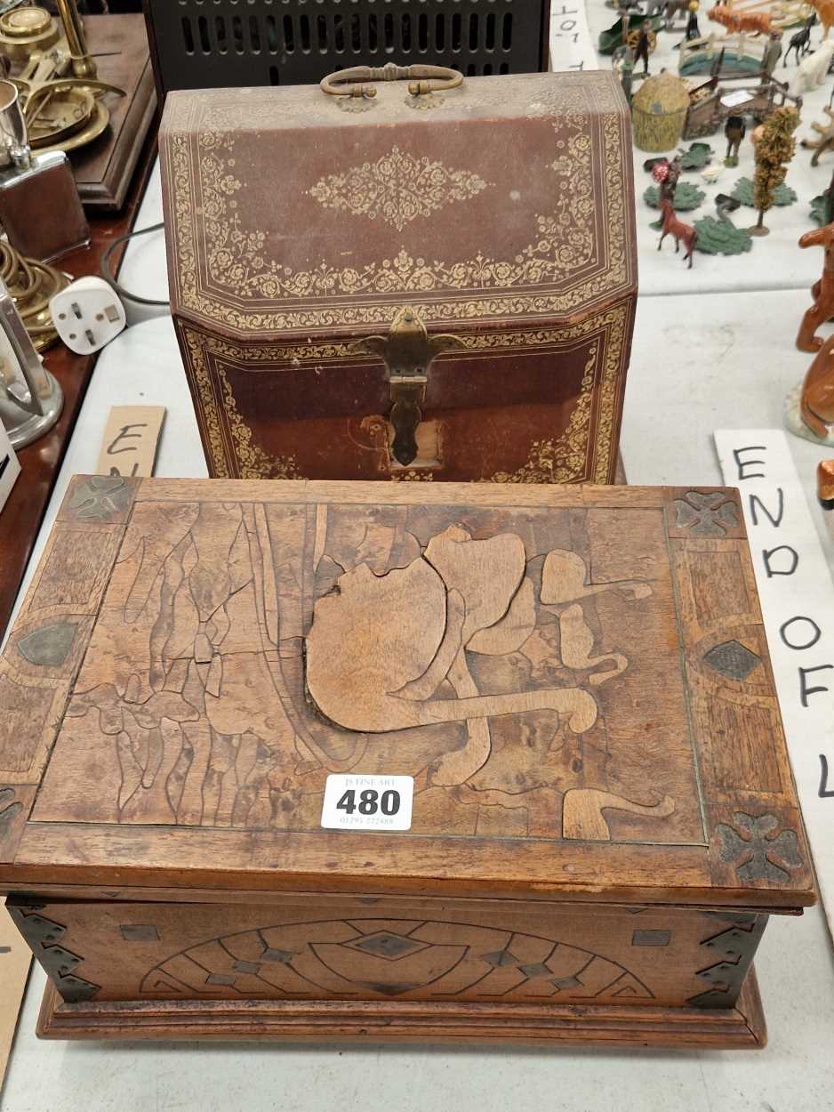 An Art Nouveau box, possibly Killarney, marquetried with swans and together with a leather mounted