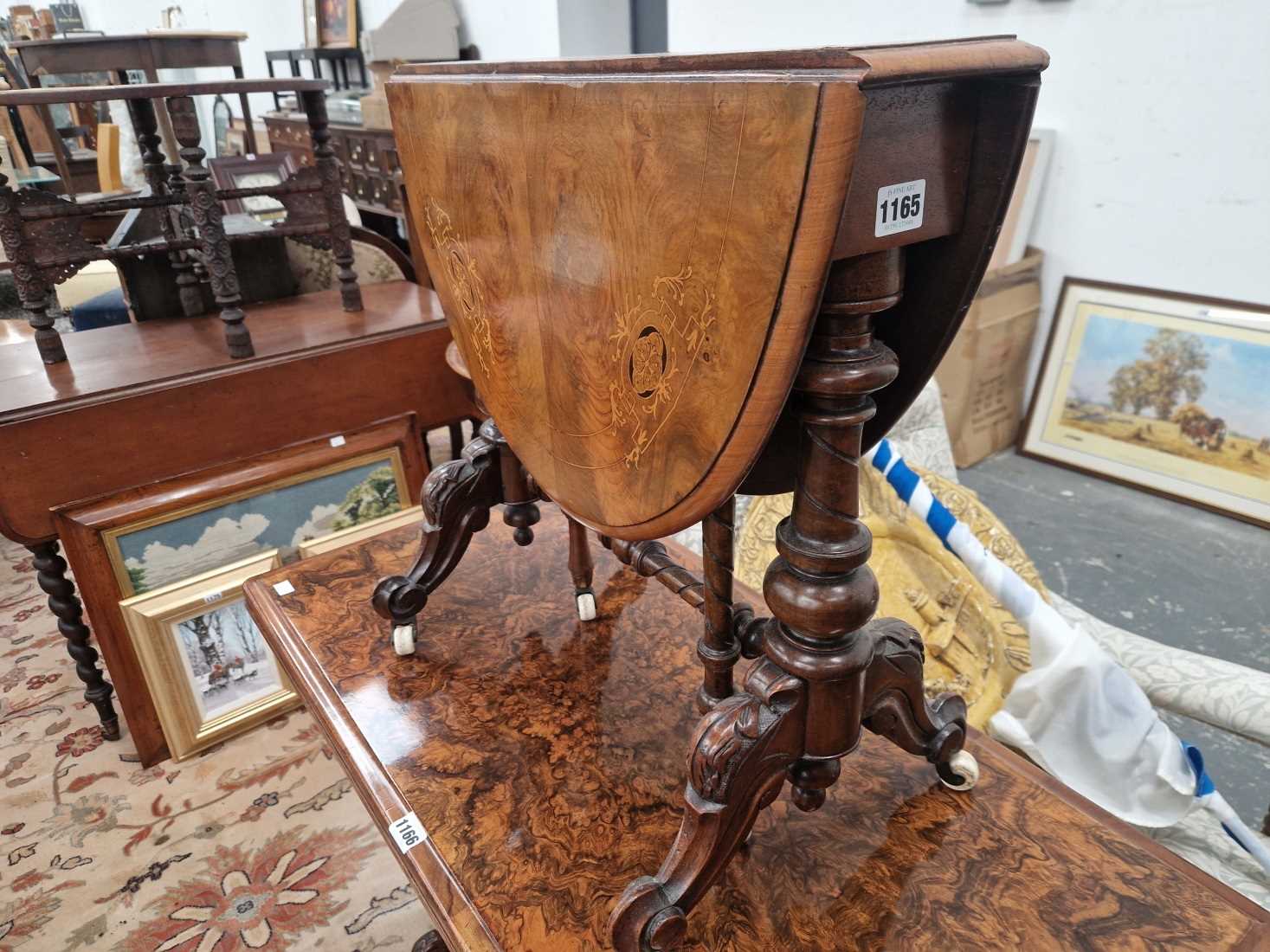 A Victorian walnut Sutherland table. there are 6 patches of veneer let into the top and two pieces