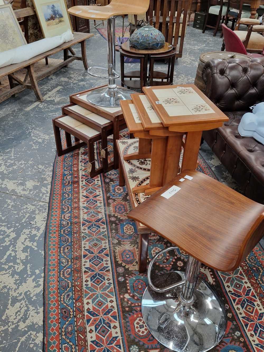 Various retro occasional tables and two stools.