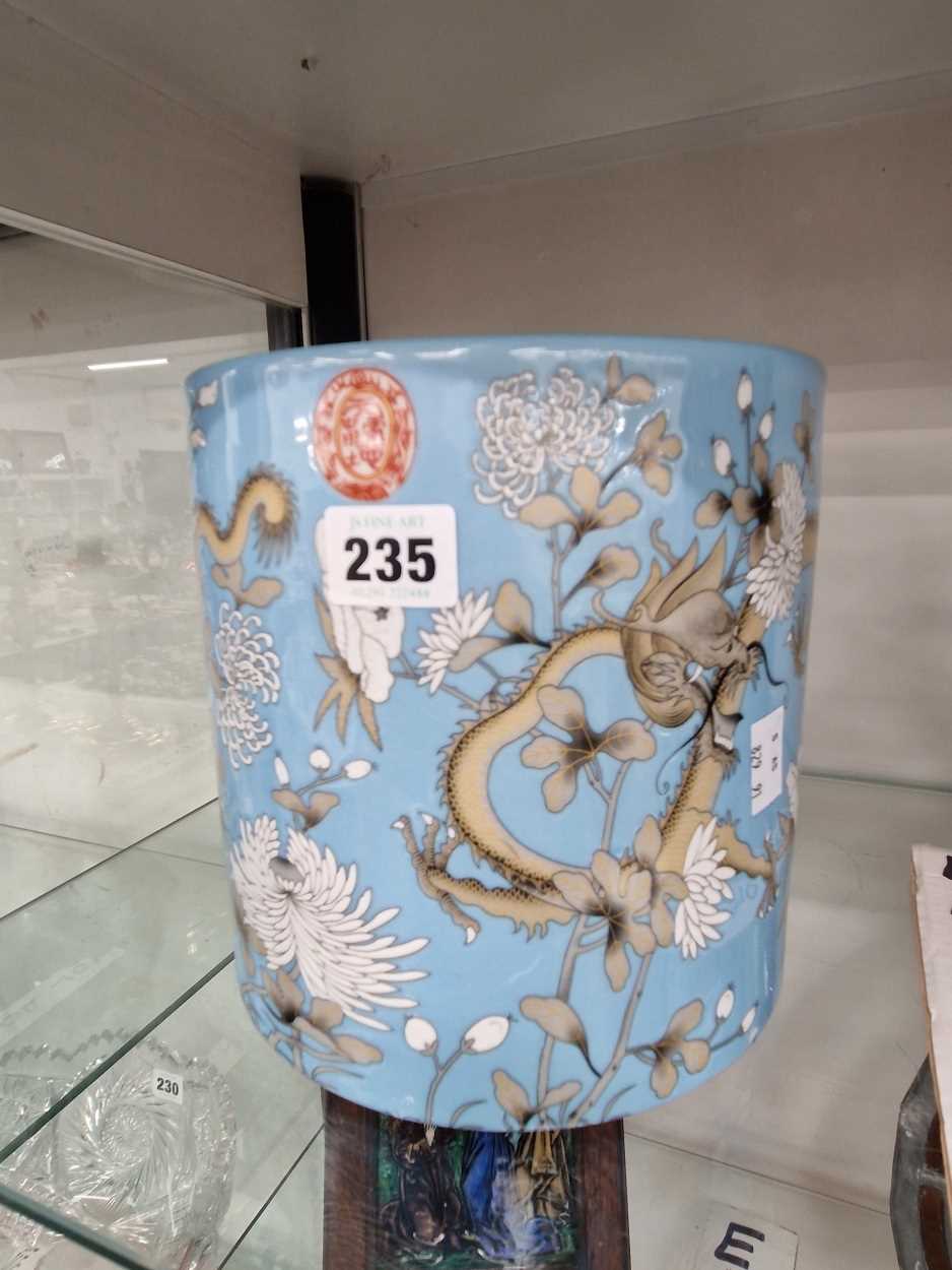 A Chinese blue ground brush pot decorated with dragons in the style of the Empress Cixis birthday