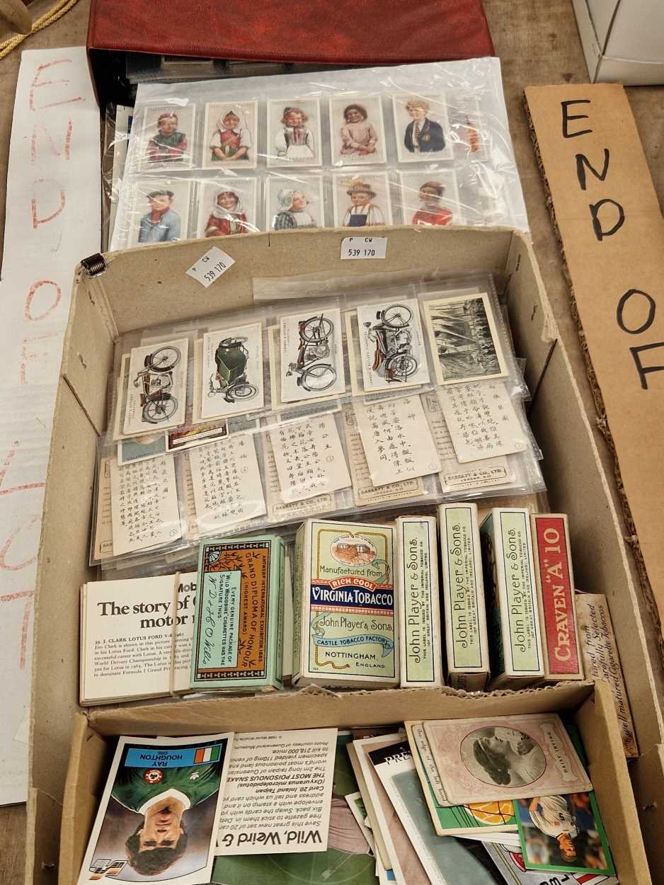 An album and sheets of cigarette cards