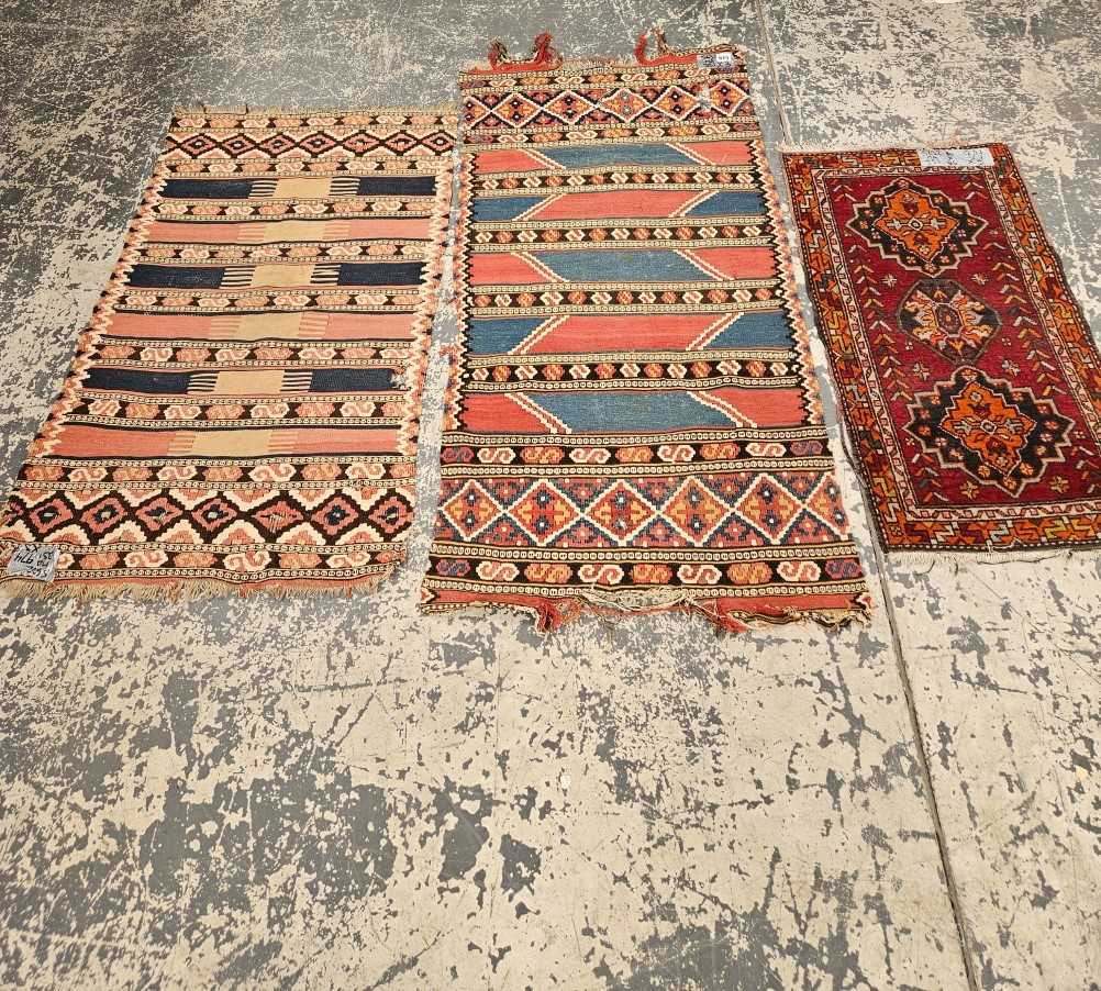 TWO ANTIQUE CAUCASIAN FLAT WEAVE PANELS TOGETHER WITH AN ANTIQUE TURKISH MAT (3)