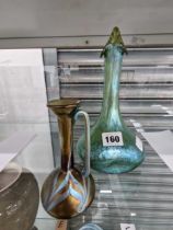 A Loetz type splashed iridescent glass bottle vase together with a ewer Good condition