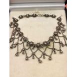 A vintage multi drop harmony ball choker style necklace. Unhallmarked, assessed as silver. Length
