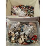 A box of various costume jewellery and a lareg quantity of loose beads.