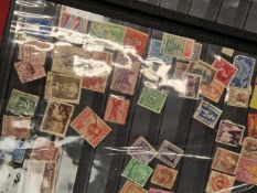An album of various world stamps.