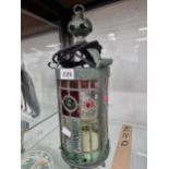 A cylindrical lantern inset with coloured leaded glass The glass in undamagedThe mounts have