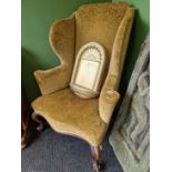 An antique high wingback arm chair. W 84 D 75 H 120 cmThe velvet damask upholstery is serviceable