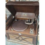 An HMV oak cased wind up gramophones together with a print