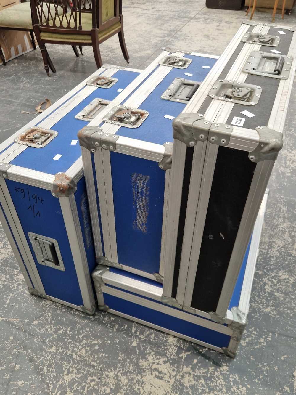 Four alloy bound protective equipment cases.