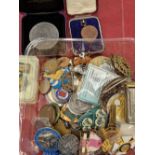 A collection of various medallions, coins, and collectables.