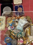A collection of various medallions, coins, and collectables.