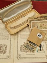 A string of costume pearls, various vinatge banknotes, cigarette cards etc.