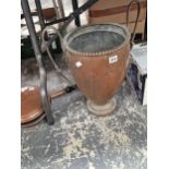 A copper two handled vase together with a copper warming pan