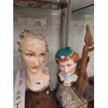 A Gennari Art Deco pottery head of a lady together with a biscuit porcelain ladys head, her hat