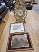 An antique cast brass cased easel back mantle clock together with two small watercolour and a