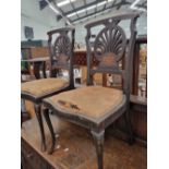 A set of three inlaid side chairs.
