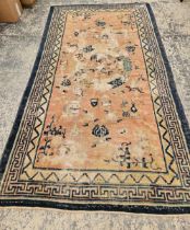 AN ANTIQUE CHINESE RUG 245 x 134 cm.