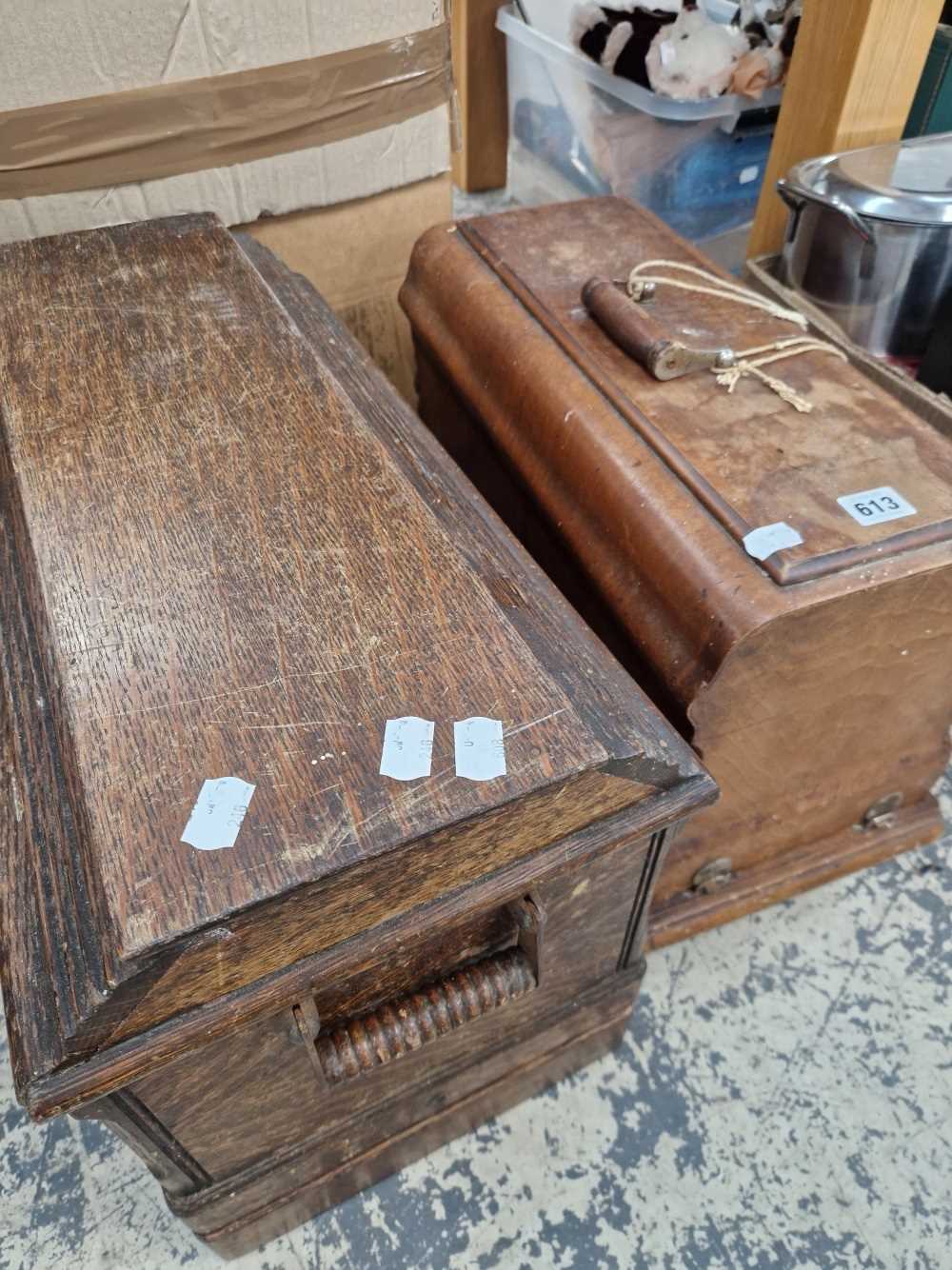 Two vintage sewing machines in wooden cases