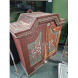 An east European painted small cabinet.
