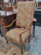 A pair of Continental walnut highback tapestry upholstered armchairs.