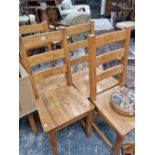 A set of 8 heavy oak dining chairs.