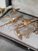 A pair of brass two branch wall lights, a towel rail and a pair of brass wall mounting candle