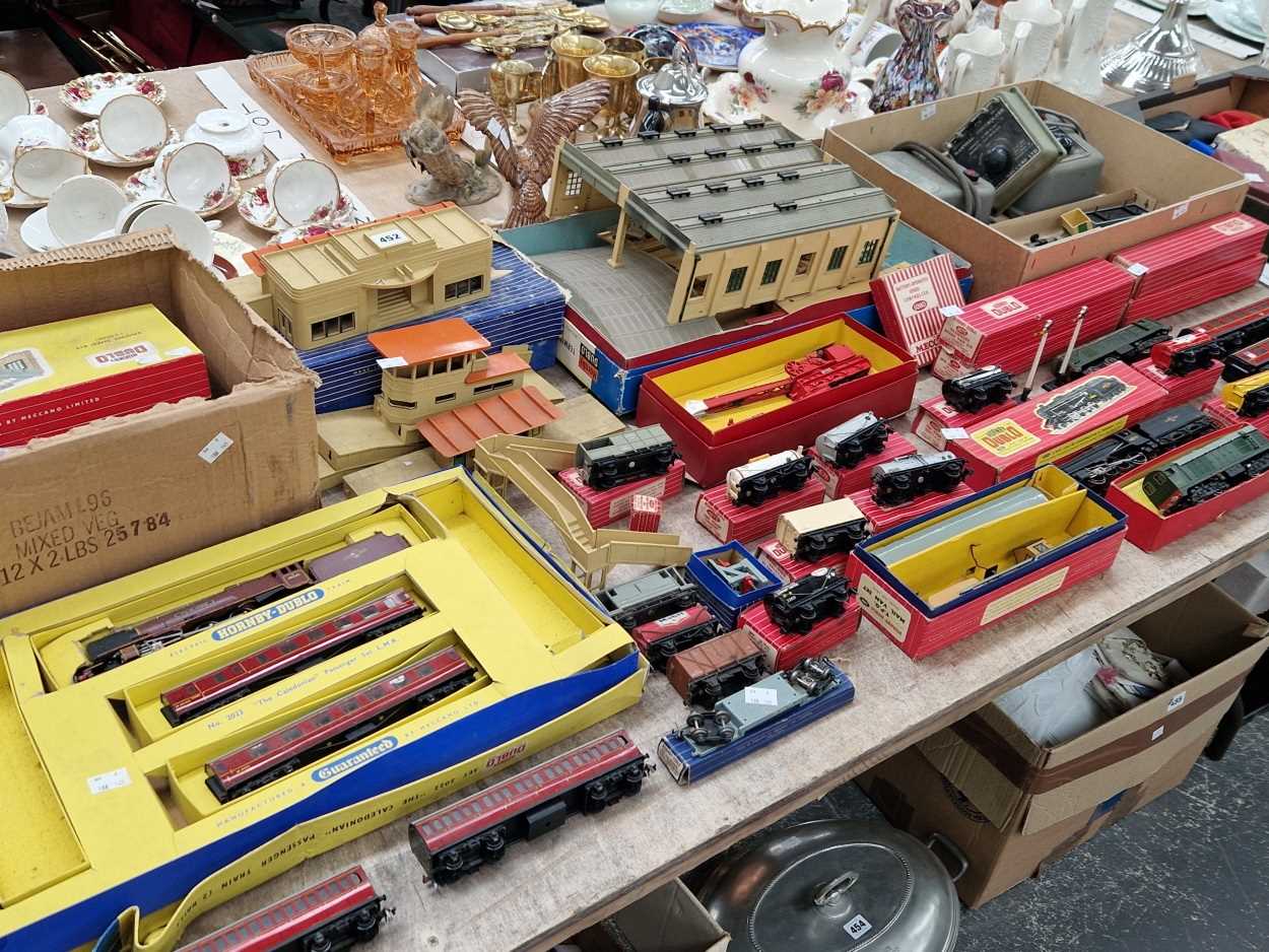 A collection of Hornby Dublo 00 guage locomotives, rolling stock, track and trackside buildings