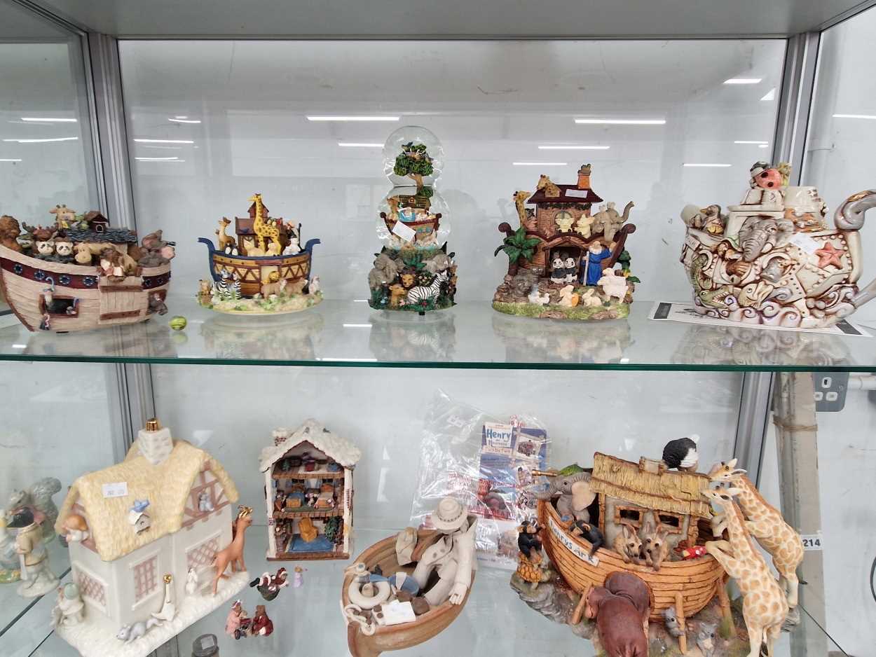 Four San Francisco musical boxes modelled with animals, figures in boats and in houses