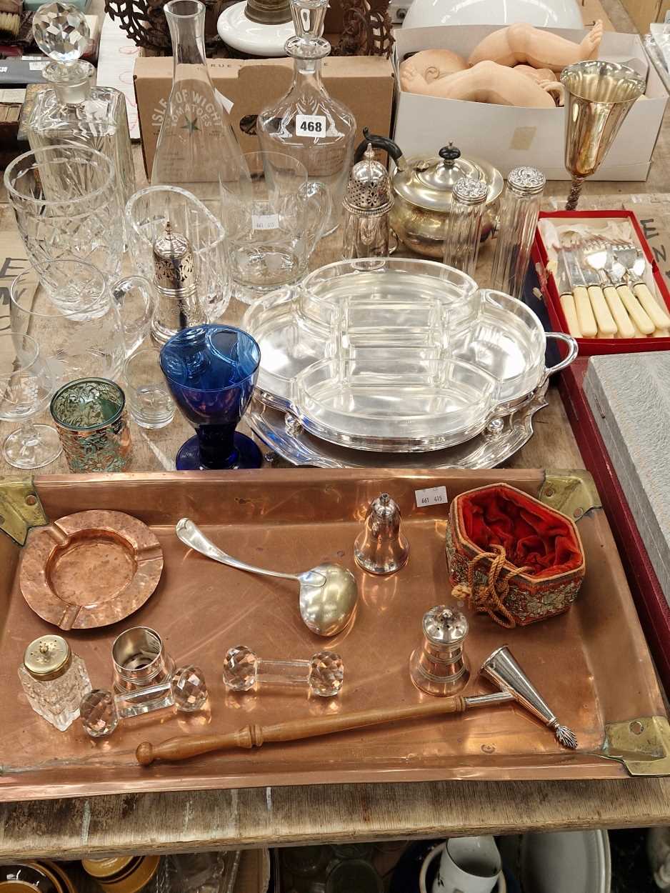 Electroplate cutlery and casters, decanters and glass ware, a cased carving,  set a copper tray,