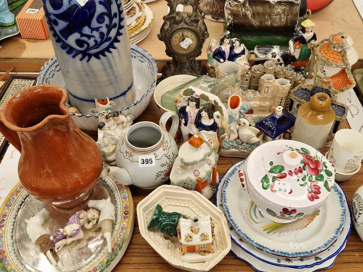 French faience plates and bowls, Staffordshire houses and figures, a clock, etc.