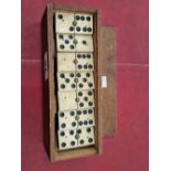 A set of antique dominos cased.