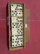 A set of antique dominos cased.