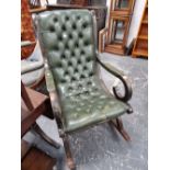 Leather upholstered rocking chair.