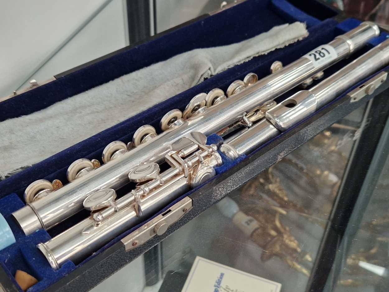 A cased Ducol silvered flute