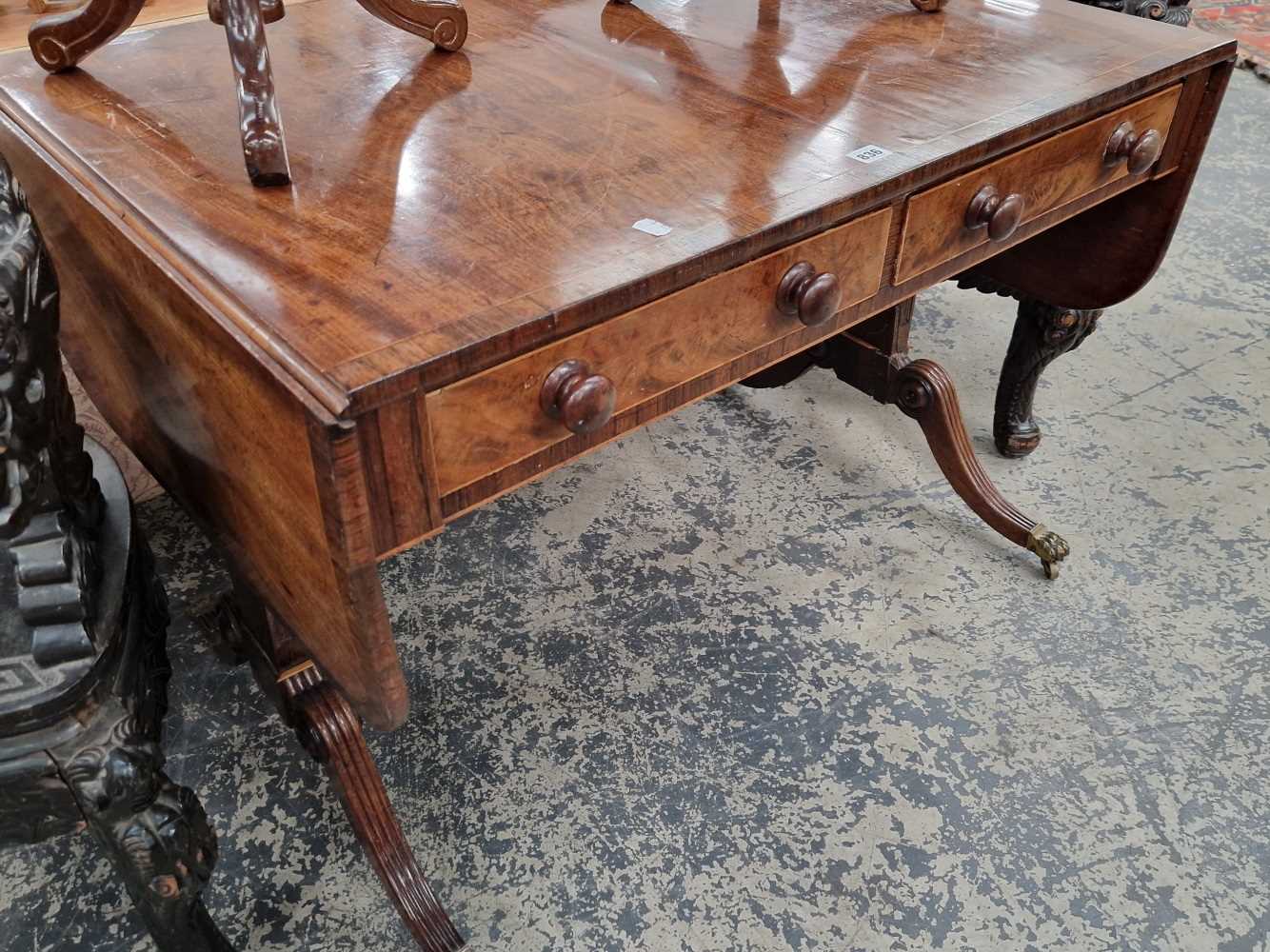 A Regency mahogany and rosewood sofa table.