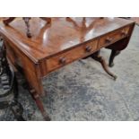 A Regency mahogany and rosewood sofa table.