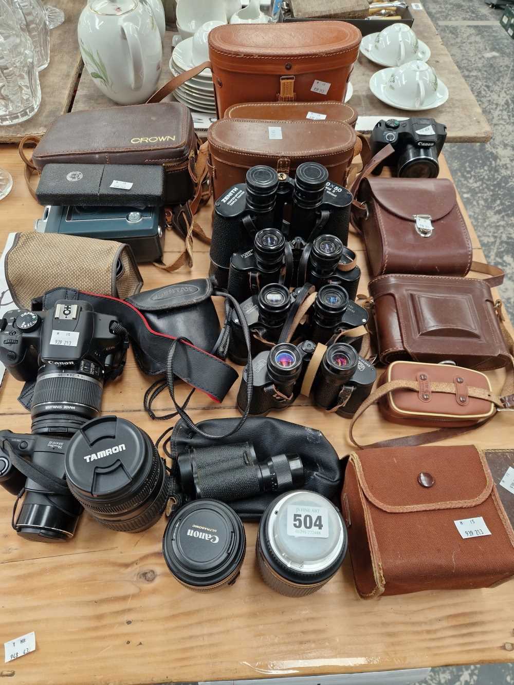 A Canon EOS camera, various lenes, 5 pairs of binuculars, a monocular and other items (qty)