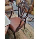 A set of five mahogany dining chairs.