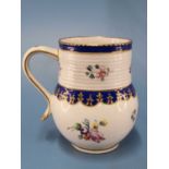 A Chelsea Derby mug with a ribbed neck band above Smiths blue lappets and painted flowers, gilt