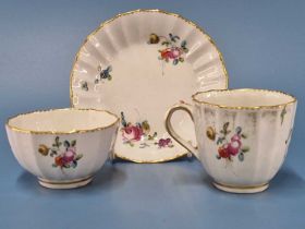 A Derby fluted trio painted with flowers within gilt dentil rim lines, blue marks, provenance the