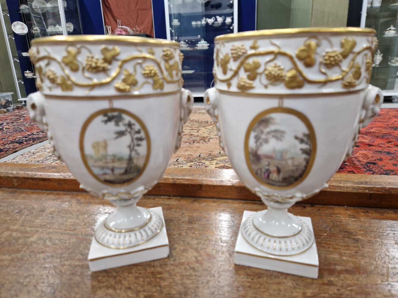 A pair of Derby ram handled vases supported on square feet painted with landscapes by Askew or - Image 6 of 17