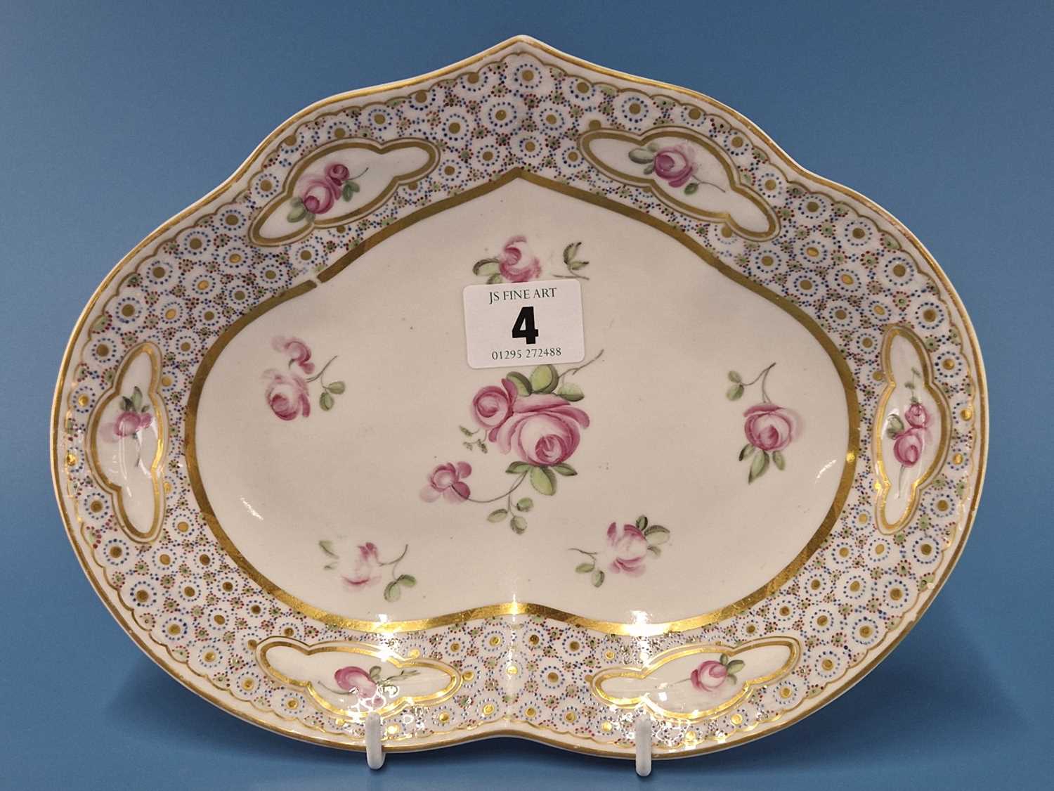 A Derby kidney shaped dish painted in the manner of Edward Withers with pink roses on and within