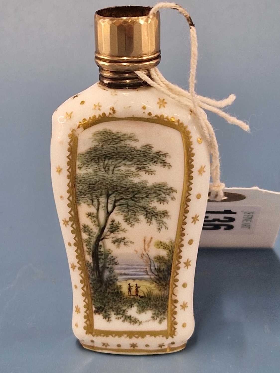 A Derby scent bottle painted on each side with a landscape below the gold screw top The screw top - Image 4 of 4