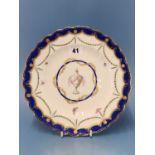 A Chelsea Derby plate painted with swags of laurel below the Smiths blue wavy rim, the central urn